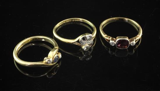 Three Edwardian 18ct gold and gem set rings, sizes M & P(2).